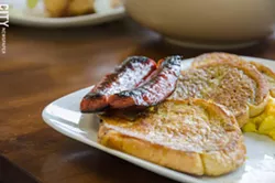 Breakfast French toast, scrambled eggs, and sausage. - PHOTO BY MARK CHAMBERLIN