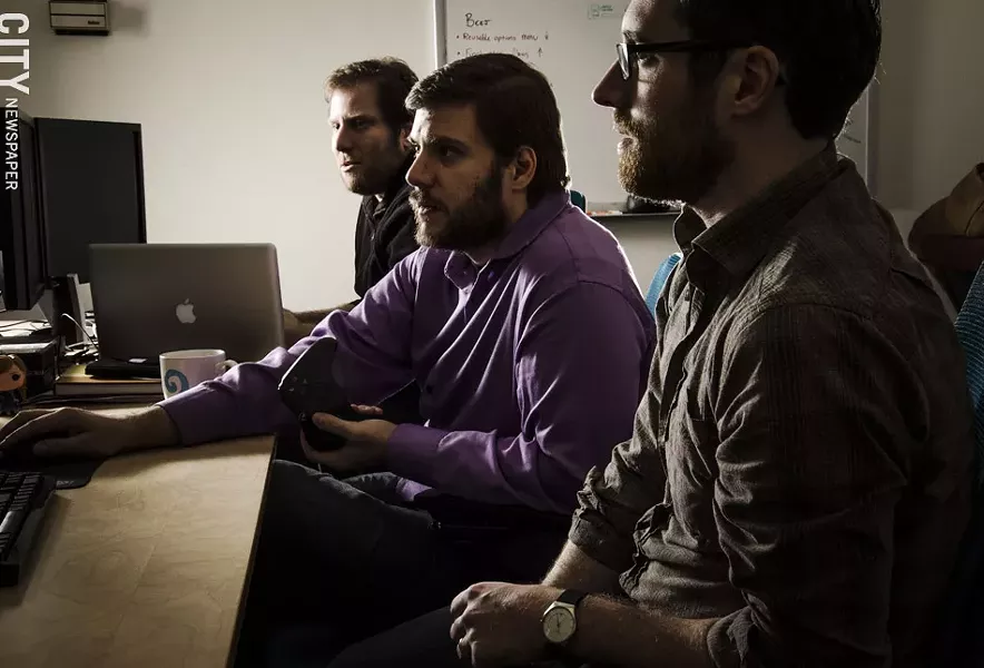 Brian Johnstone, Matthew Mikuszewski, and Colin Doody — along with Scott Flynn — co-founded Darkwind Studios while they were still students. The company now employs 15 people, most of whom are graduates from RIT. - PHOTO BY MARK CHAMBERLIN