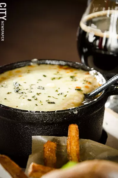 French Onion Soup with a chèvre-grilled-cheese crouton from The Angry Goat. - PHOTO BY MARK CHAMBERLIN