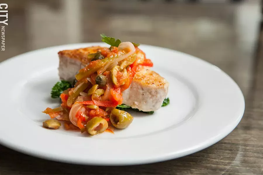 Fresh Fish Mojito Isleno with wild-caught striped bass, reflective of Puerto Rico. - PHOTO BY JOHN SCHLIA