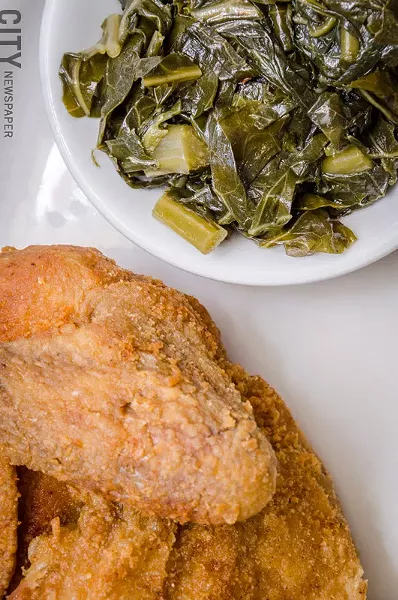 Fried chicken and collard greens. - PHOTO BY MARK CHAMBERLIN