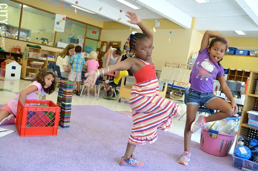 Gloria Milosevic (with blocks), Jahlyse Quick, and Kimoni Quamina have completed the city school district's prekindergarten program at Rochester Childfirst Network, 941 South Avenue. They will enter kindergarten this school year. - PHOTO BY MATT DETURCK