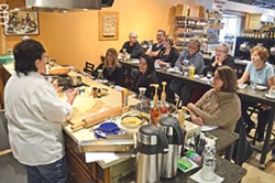 Learning to cook can benefit your palate and your wallet. Many area businesses offer cooking classes, including Rosario Pino's Artisan Foods in East Rochester (pictured). - FILE PHOTO