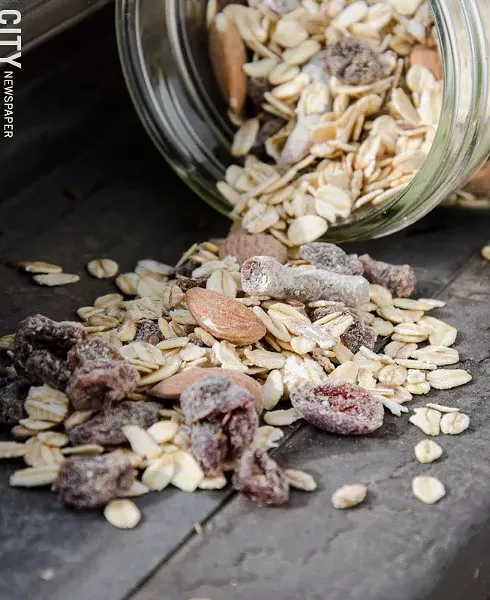 Locally made Muesli Fusion comes in six varieties, including Classic Swiss (pictured), featuring grains, flax seeds, dates, raisins, almonds, and cranberries. - PHOTO BY MARK CHAMBERLIN