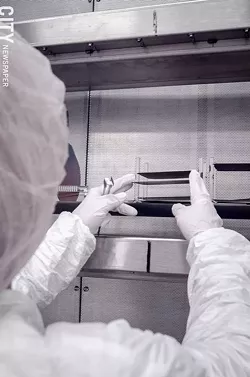 Natcore technician Wendy Ahearn in a clean room in the company's facility at Eastman Business Park. - PHOTO BY MARK CHAMBERLIN