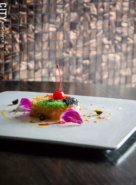 Salmon toro tartar (a patty of raw, diced salmon belly, blended with diced mango and topped with caviar and a maraschino cherry) - PHOTO BY MARK CHAMBERLIN