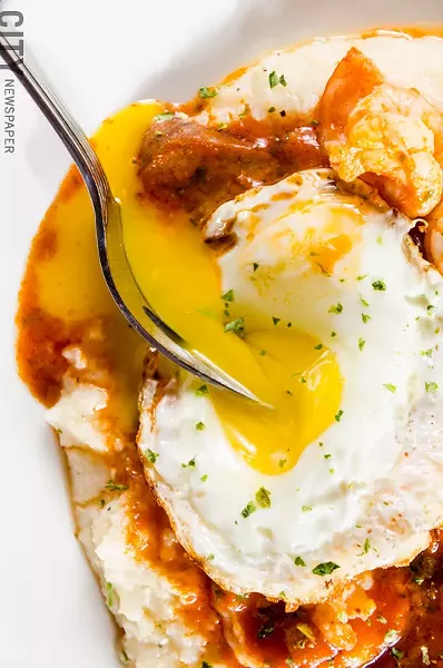 Shrimp and grits: andouille sausage and seasoned shrimp over stone ground grits. - PHOTO BY MARK CHAMBERLIN