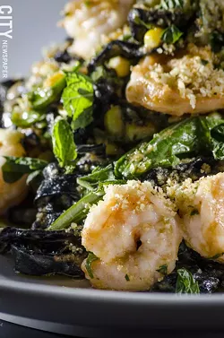 Squid ink fettuccine with rock shrimp, charred corn, arugula, tomato, and jalapeño from Avvino. - PHOTO BY MARK CHAMBERLIN