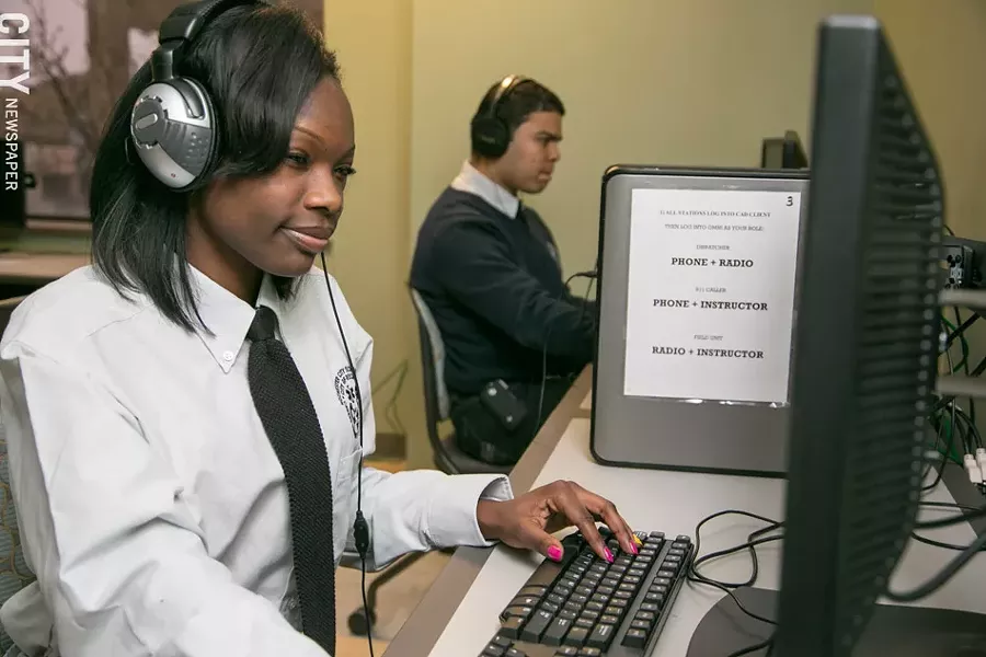 Students Amina Avjam and Abismael Diaz train on the 911 call center simulator. - PHOTO BY MIKE HANLON