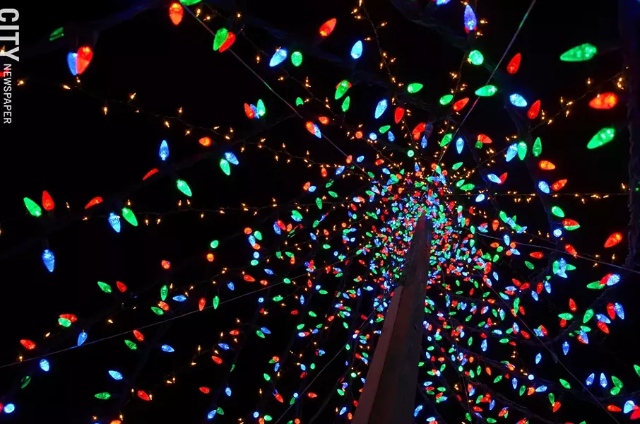 The entire neighborhood of Colony Lane, a cul-de-sac in Henrietta, gets involved with a massive holiday light display. - PHOTO BY MATT DETURCK