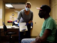 Low-income neighborhood groups asked to spread word about COVID vaccines