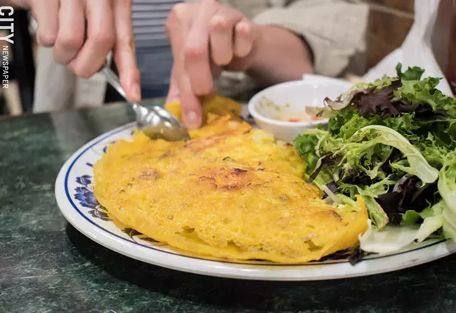 The bánh xèo is a crispy, savory pancake, filled with a mix of shrimp, sprouts, onions, and other vegetables. - PHOTO BY JACOB WALSH