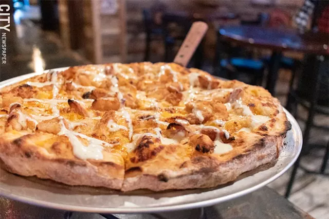 The Country Sweet pizza features the titular sauce for a base, chopped chicken tenders, and cheddar. - PHOTO BY JACOB WALSH