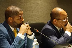 Superintendent Terry Dade and school board President Van White listen to one of the 95 speakers at Thursday night's meeting. - PHOTO BY GINO FANELLI