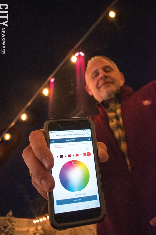 Mark Glickman, head of facilities at Buckingham Properties, shows the app he uses to control the lights on some of Buckingham's Properties. - PHOTO BY RYAN WILLIAMSON