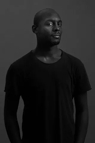 Jiréh Breon Holder sat for a portrait by McFadden and answered prompts about the concepts of manhood and freedom. - PHOTO BY JOSHUA MCFADDEN