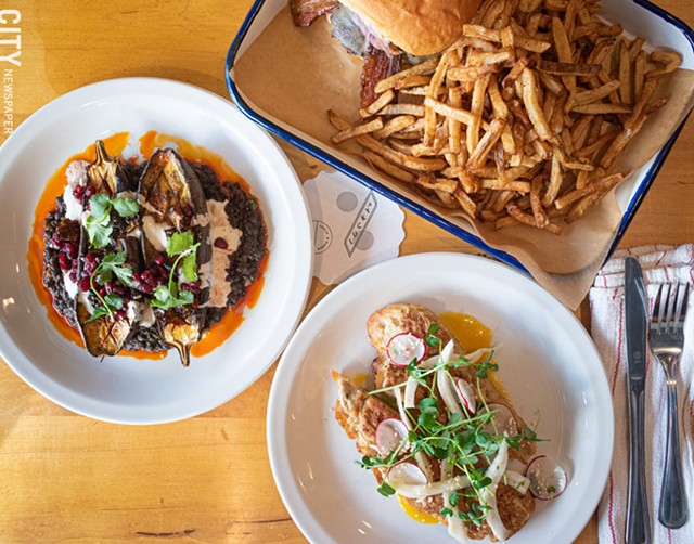Clockwise from left: roasted eggplant, pub burger, duck toast tartine. All three dishes are on both the lunch and dinner menus. - PHOTO BY JACOB WALSH