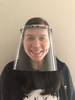 Katie Pastene, a nurse practitioner, shows one of the face shields made through the efforts of her wife, Coty Pastene. - PHOTO PROVIDED