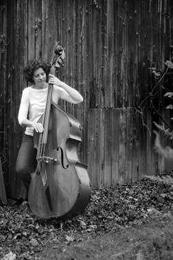 Despite her hearing loss, double bassist McCormick still teaches music and serves as Eastman Performing Arts Medicine's program manager. - PHOTO BY DANIEL FISCHER
