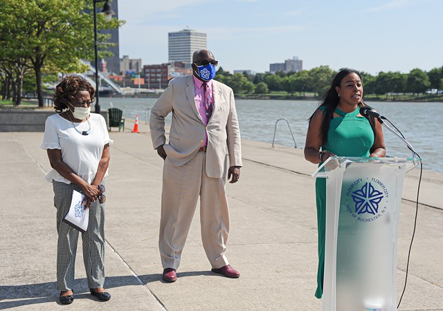 Mayor Lovely Warren, right, stands with Commissioner of Environmental Services Norman Jones and City Council President Loretta Scott to announce the start of a project to rebuild a section of the west wall of the Genesee River. - PHOTO BY JEREMY MOULE