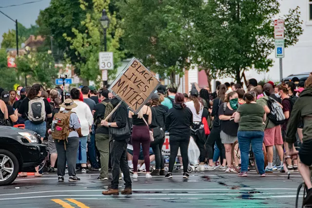 Protesters gathered at the intersection of Jefferson Avenue and Dr. Samuel McCree Way. - PHOTO BY JACOB WALSH