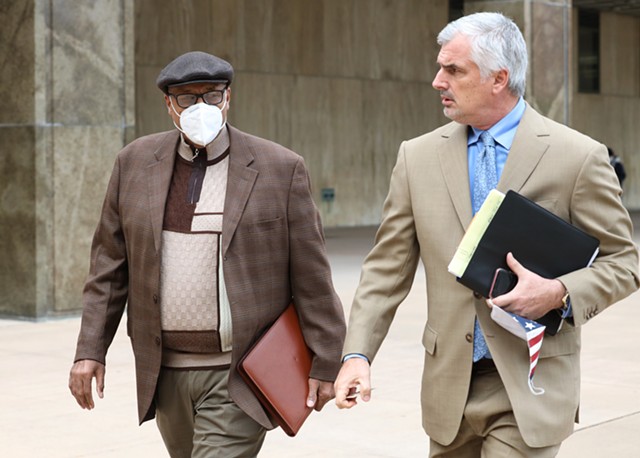 Albert Jones Jr. (left), the former treasurer of the Friends of Lovely Warren campaign committee, leaves the courthouse after his arraignment on felony charges related to alleged campaign finance allegations on Oct. 5, 2020. - PHOTO BY MAX SCHULTE