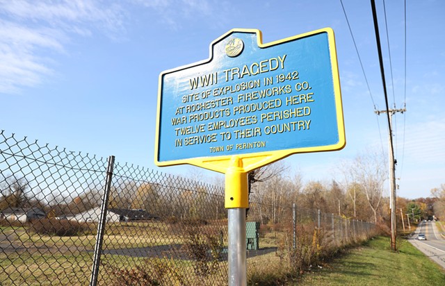 An historic marker at the site of the former Rochester Fireworks Company on Whitney Road in Perinton. On November 6, 1942, an explosion at the plant sparked a fire that killed twelve people. - PHOTO BY MAX SCHULTE