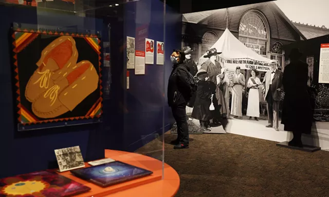 Jennifer Jess of Rochester looks at local icons of the suffrage movement. - PHOTO BY MAX SCHULTE