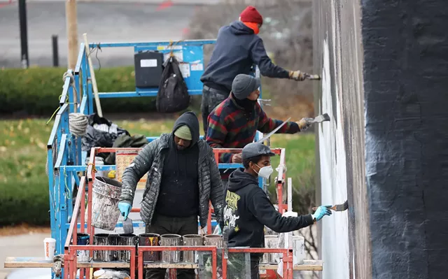 Rochester native Ephraim Gebre led a team of painters to complete the mural 