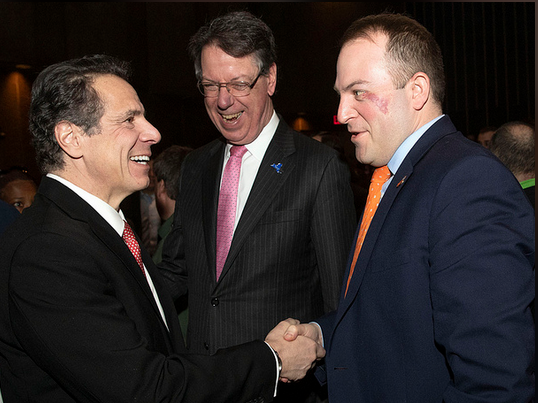 Dave Seeley, right, greets Gov. Andrew Cuomo as Brighton Supervisor Bill Moehle looks on in 2019. - PHOTO PROVIDED BY THE OFFICE OF THE GOVERNOR