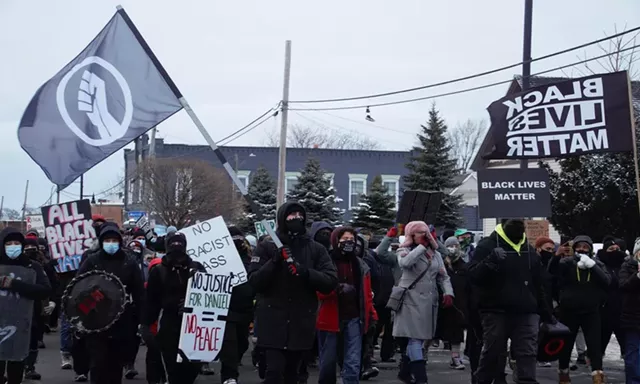 Protesters march down North Clinton Avenue in response to the video of a Rochester Police Department officer pepper spraying a 9-year-old girl. - PHOTO BY GINO FANELLI
