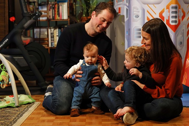 Rachel and David Berk with their children, 4-month-old Harper and 2-year-old Owen. The Berks will be moving into their new home in Pittsford in March. - PHOTO BY MAX SCHULTE