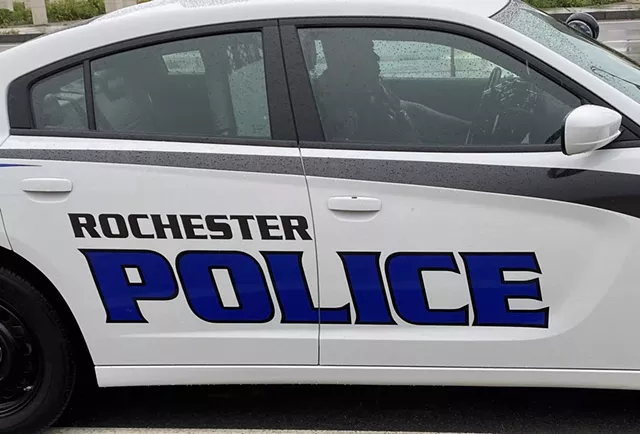 A police officer inside a Rochester Police Cruiser. - PHOTO BY JAMES BROWN, WXXI NEWS
