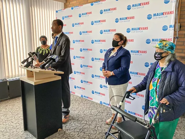 Democratic Mayoral Candidate Malik Evans released his plan to combat gun violence on Friday, May 21. Standing with him at the podium were his wife, Shawanda Evans, his wife’s stepmother Andrea Brown, County Legislature candidate Mercedes Vazquez-Simmons, and Belen Colon, a supporter and a long-time civil rights activist. - PHOTO BY JEREMY MOULE