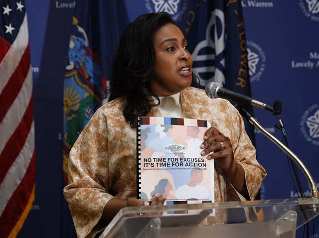 Mayor Lovely Warren holds the final report from the Commission on Racial and Structural Equity. - PHOTO BY MAX SCHULTE