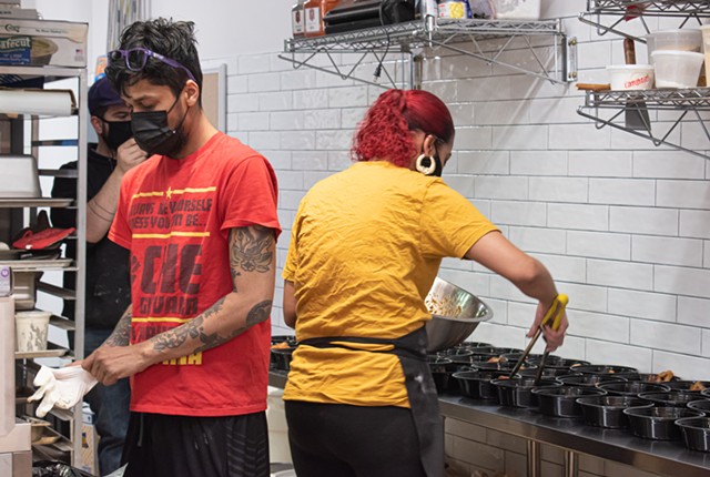 Meghesh Pansari and one of his workers prepare meals during a weeknight rush. Pansari urged his employees to unionize when he opened his restaurant. - PHOTO BY JACOB WALSH