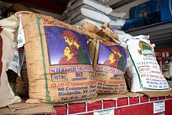 Varieties of basmati rice at Namaste Cash & Carry. - PHOTO BY JACOB WALSH