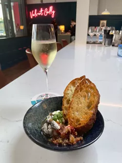 Velvet Belly's House-made Ricotta, which is served with roasted cherry tomato ‘pappa al pomodoro,’ marinated Spanish anchovies, and crostini. - PHOTO BY REBECCA RAFFERTY