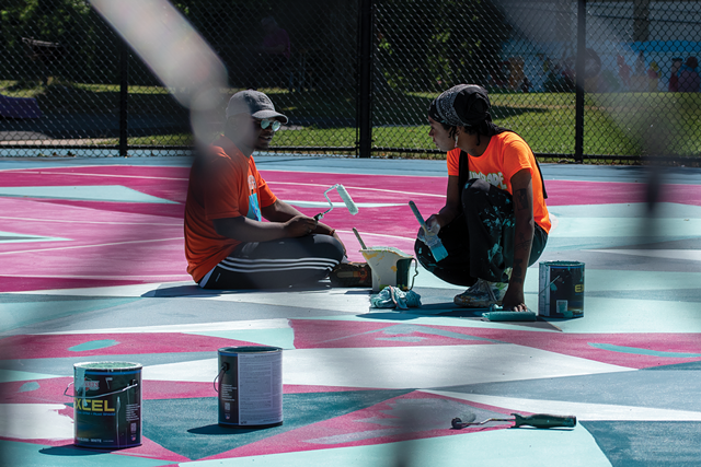 Marcus Austin and Paris Cockrell paint and chat on the last day of the 2021 Peculiar Asphalt season. - PHOTO BY RYAN WILLIAMSON