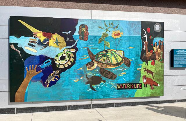 Peter Jemison's mural, "Water is Life," depicts the Haudenosaunee creation story. - PHOTO BY REBECCA RAFFERTY