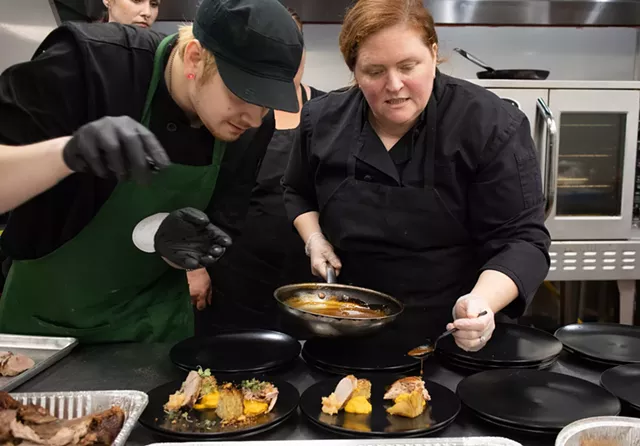 Sous Chef Harry Gavens and owner-chef Lindsay McGrail plate the second course at a fall prix fixe dinner hosted by Green Zebra. - PHOTO BY QUAJAY DONNELL