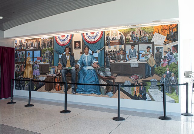 A new mural based on the lives of Frederick Douglass, his family members, and close associates, now hangs in the public flight observation deck at the Frederick Douglass Greater Rochester International Airport. - PHOTO BY JACOB WALSH