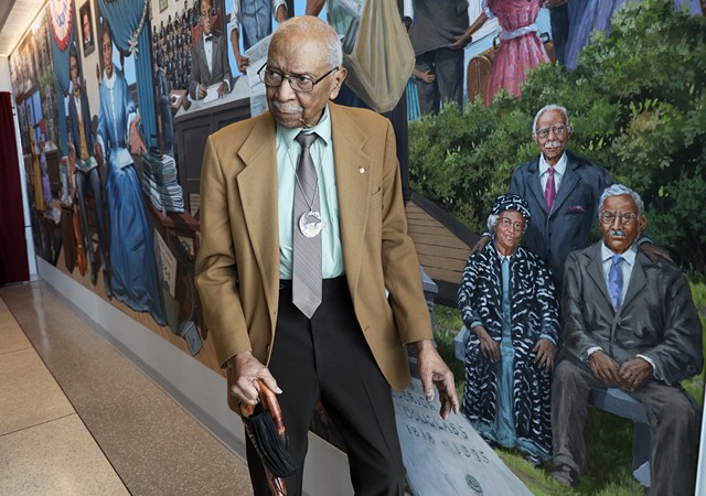 David Anderson, a professor and noted Frederick Douglass scholar, at the unveiling of the Douglass mural in the county airport. Anderson is included in the mural — Michelle Daniels, who commissioned the painting,  said Anderson was invaluable in its development. - PHOTO BY MAX SCHULTE