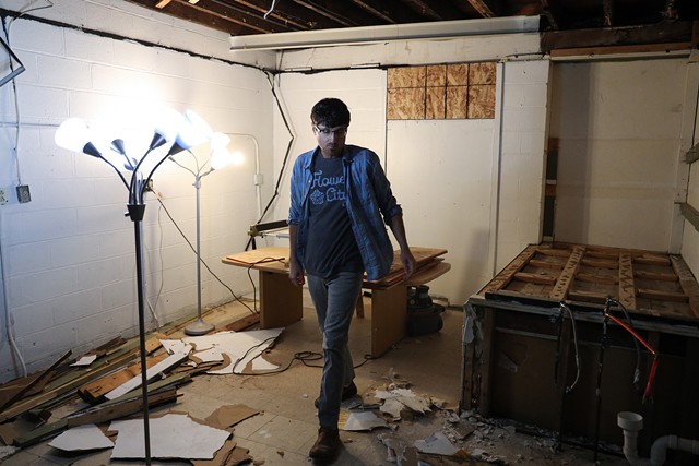 Mike Dellaria tears apart a former commercial kitchen to make room for what he hopes will be his studio. "It's an ongoing task," he says of the job. - PHOTO BY MAX SCHULTE