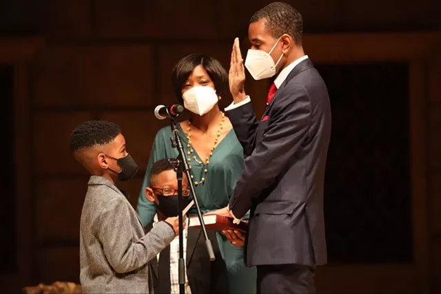 Mayor Malik Evans's family stood with him as he took the oath of office at his inauguration ceremonies Saturday. - PHOTO BY MAX SCHULTE