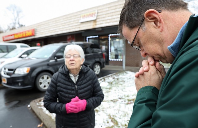 Donna Ecker and Ed Knauf are among a small ministry of Catholic faithful who pray for victims of homicides. “The idea is to reconsecrate the ground and let the neighbors know that there are those who support them,” Ecker said. - PHOTO BY MAX SCHULTE