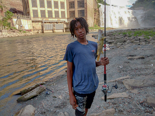 Julius Greer Jr. fishing in the Genesee River. He was 14 years old when he was shot and killed on Jan. 2, 2022. - PHOTO COURTESY OF JULIUS GREER SR.