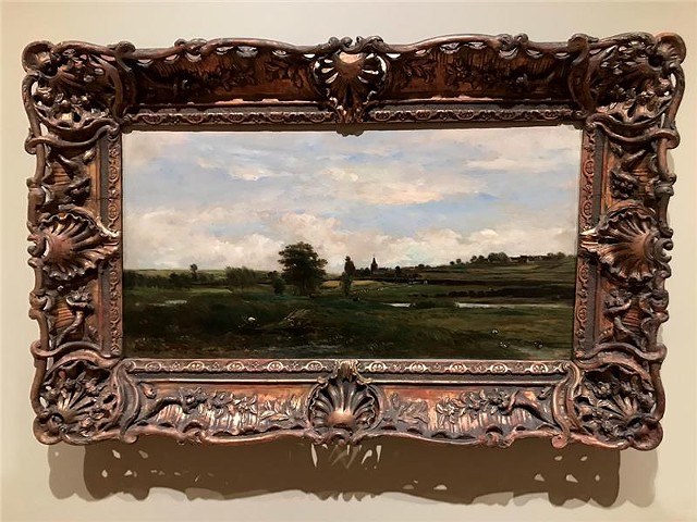 The pastoral landscape "Near Andresy," by Charles Francois Daubigny, hangs in a "cringe frame" whose showiness contrasts with the simplicity of the work. MAG is eyeing a new frame priced at $11,000. - PHOTO BY DAVID ANDREATTA