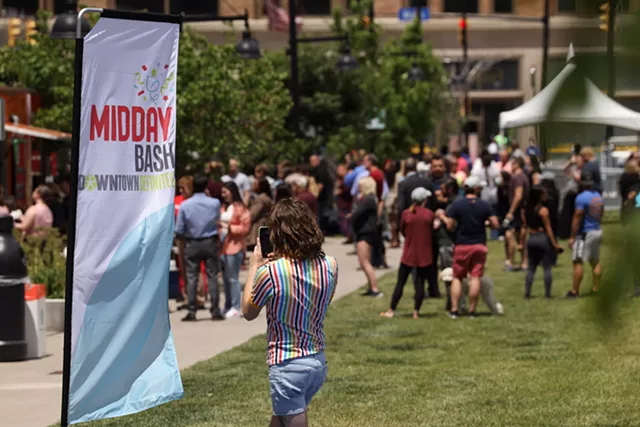 Parcel 5 was the site of the "Midday Bash," part of the Rochester Downtown Development Corp.'s "Downtown Definitely" campaign to draw people to the city's center with food trucks, music, lawn games, and fitness instructors. - PHOTO BY MAX SCHULTE