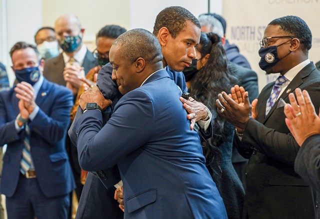 Simeon Banister, now the president of the Rochester Area Community Foundation, and Mayor Malik Evans embrace last year at the launch of the North Star Coalition. - PHOTO BY MAX SCHULTE